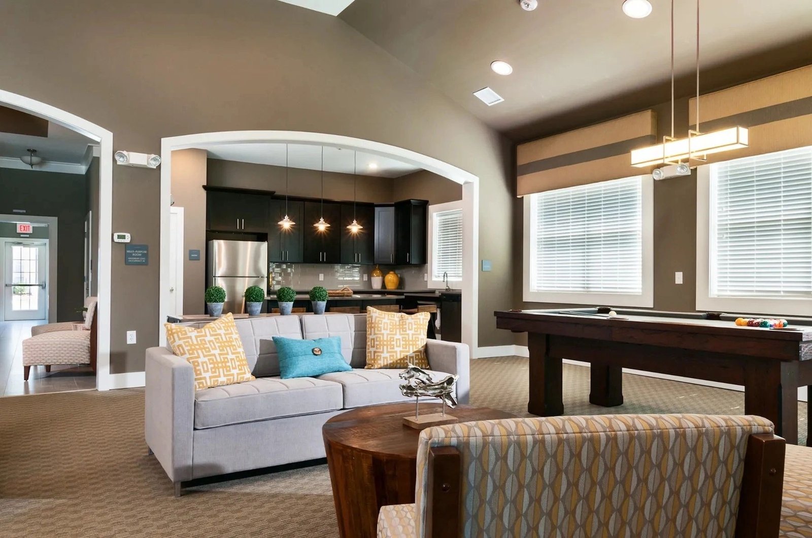 Morgan Bluff great room with billiards and lounge seating.